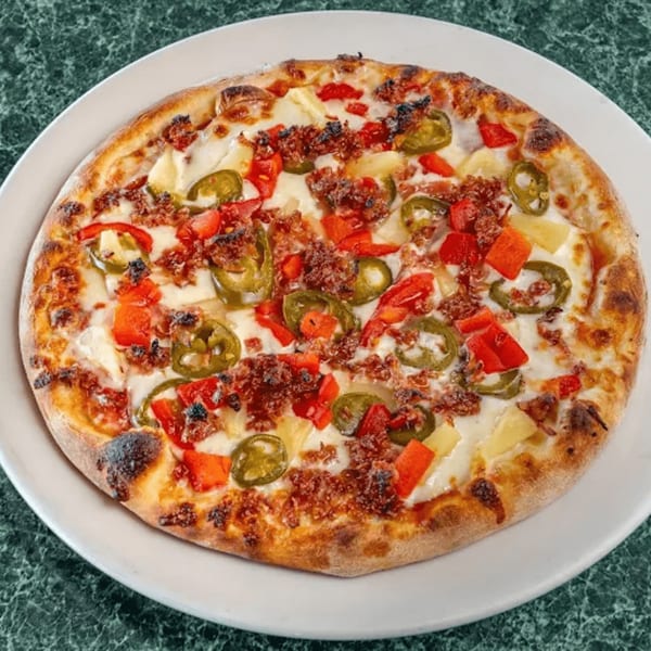 North Beach Pizza's pizza with cheese, red peppers, jalapeños, pineapple, and crumbled sausage.
